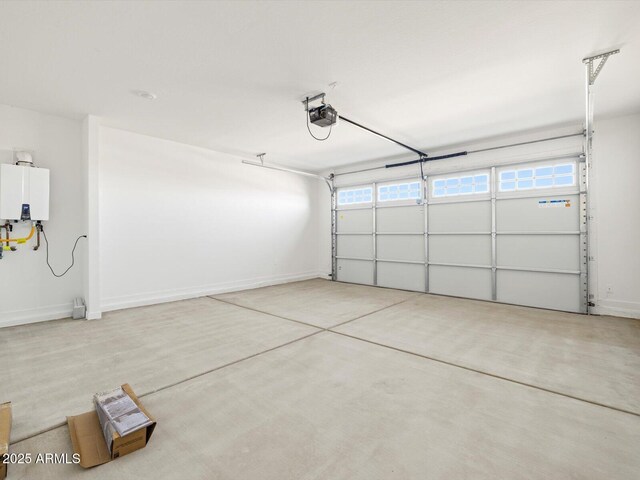 garage with a garage door opener and tankless water heater