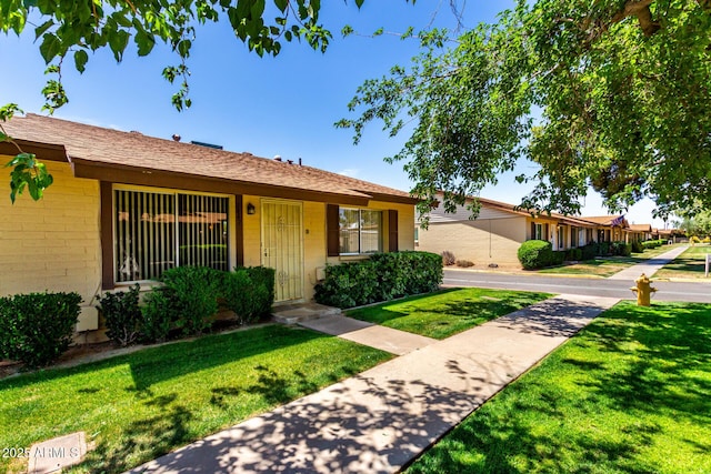 2442 N 22nd Ave, Phoenix, AZ 85009 - single story home featuring a front yard and concrete block siding