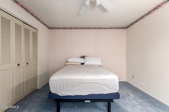 2442 N 22nd Ave, Phoenix, AZ 85009 - bedroom featuring a closet, carpet flooring, a ceiling fan, a textured ceiling, and baseboards