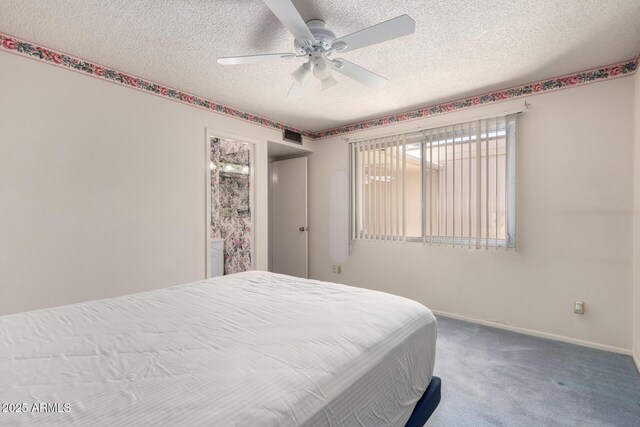 2442 N 22nd Ave, Phoenix, AZ 85009 - carpeted bedroom with a textured ceiling, baseboards, and a ceiling fan