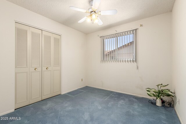 2442 N 22nd Ave, Phoenix, AZ 85009 - unfurnished bedroom featuring carpet floors, a textured ceiling, a closet, ceiling fan, and baseboards