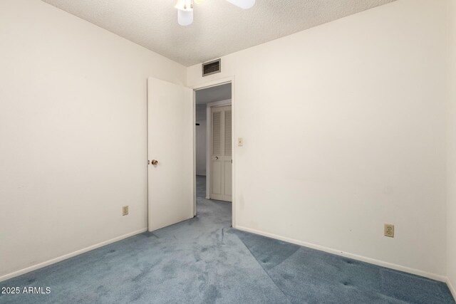 2442 N 22nd Ave, Phoenix, AZ 85009 - spare room featuring carpet floors, baseboards, ceiling fan, and a textured ceiling