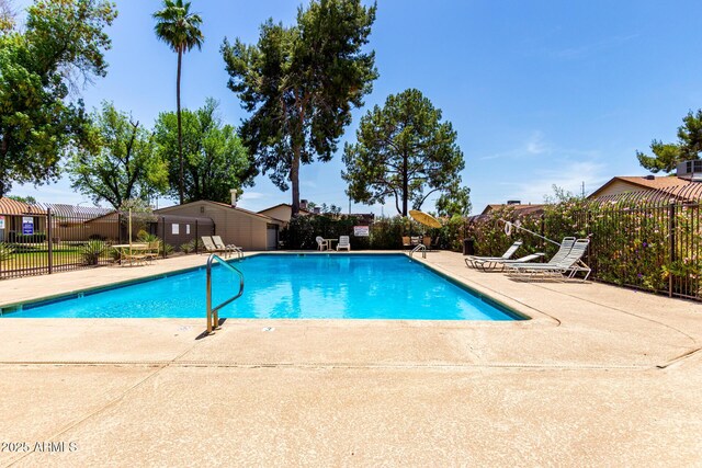 2442 N 22nd Ave, Phoenix, AZ 85009 - community pool featuring fence and a patio area