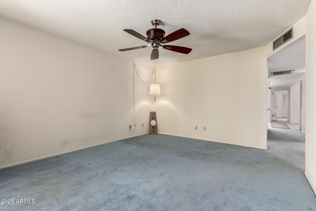2442 N 22nd Ave, Phoenix, AZ 85009 - unfurnished room with ceiling fan, carpet, a textured ceiling, and baseboards
