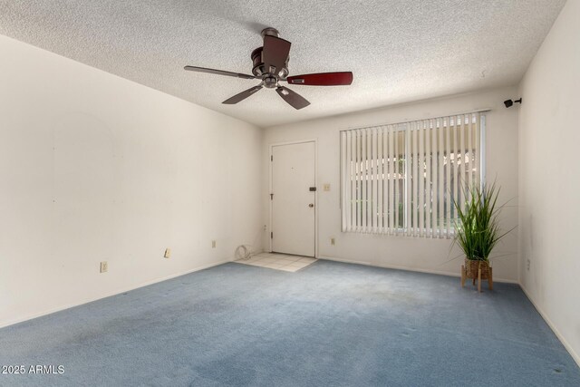 2442 N 22nd Ave, Phoenix, AZ 85009 - unfurnished room featuring carpet flooring, ceiling fan, a textured ceiling, and baseboards