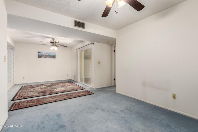 2442 N 22nd Ave, Phoenix, AZ 85009 - spare room with a ceiling fan, carpet, baseboards, and a textured ceiling