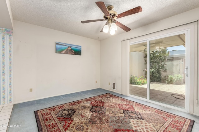 2442 N 22nd Ave, Phoenix, AZ 85009 - spare room with carpet, a ceiling fan, and a textured ceiling