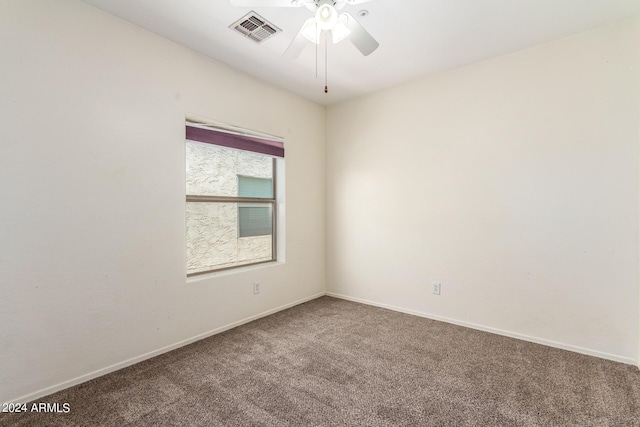 empty room featuring ceiling fan and carpet floors