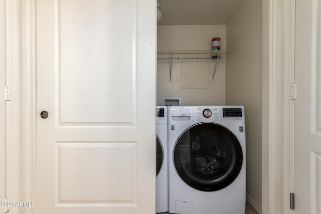 clothes washing area featuring washer / dryer