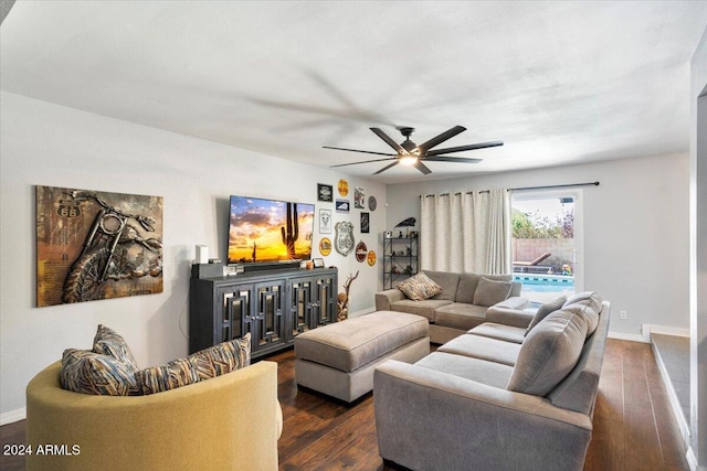 living room with dark hardwood / wood-style floors and ceiling fan