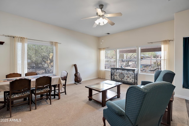 44421 N 12th St, New River, AZ 85087 - carpeted living area featuring a ceiling fan and baseboards