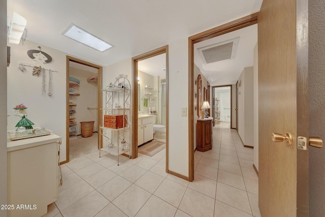 corridor with light tile patterned floors