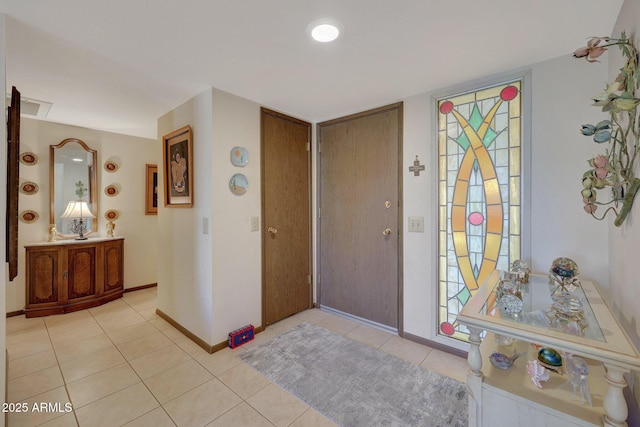 entrance foyer with light tile patterned flooring