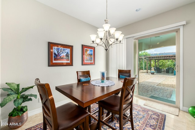 tiled dining area with a notable chandelier