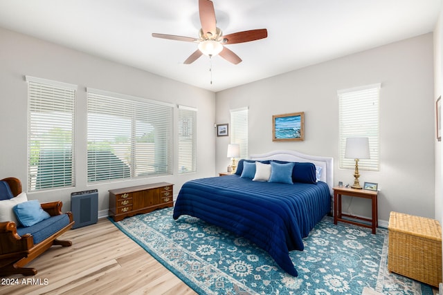 bedroom featuring hardwood / wood-style floors and ceiling fan