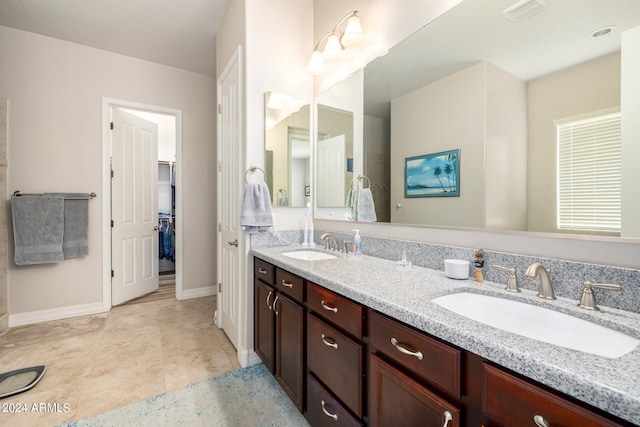 bathroom with vanity and tile patterned floors