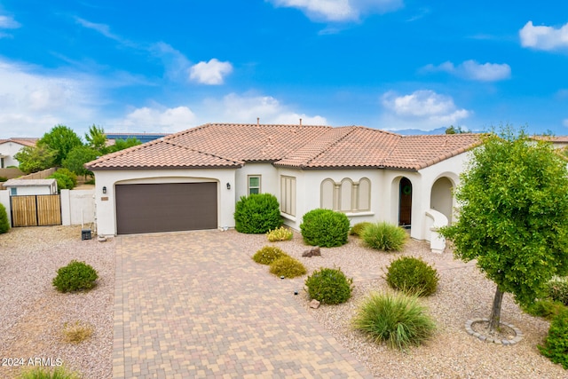 mediterranean / spanish-style house featuring a garage