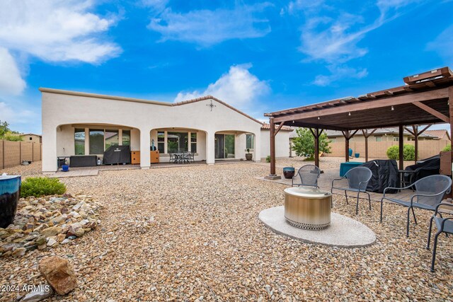 rear view of property featuring a patio area