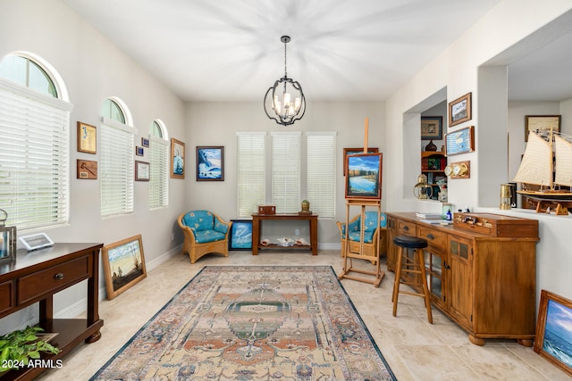 office space featuring light tile patterned floors and a notable chandelier