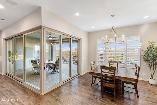 dining area featuring plenty of natural light, baseboards, and wood finished floors