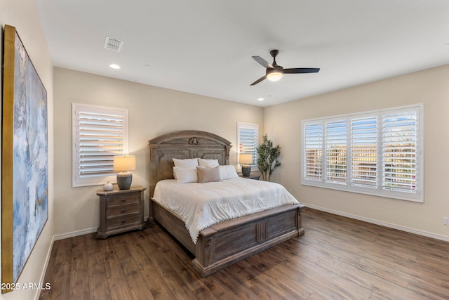 bedroom with recessed lighting, visible vents, baseboards, and wood finished floors