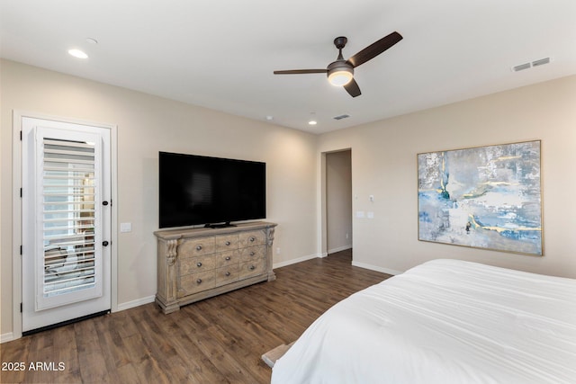 bedroom with wood finished floors, baseboards, visible vents, and recessed lighting