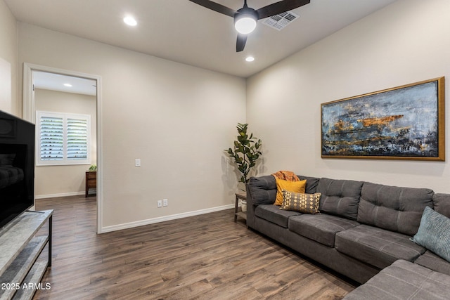 living area with visible vents, baseboards, a ceiling fan, dark wood finished floors, and recessed lighting