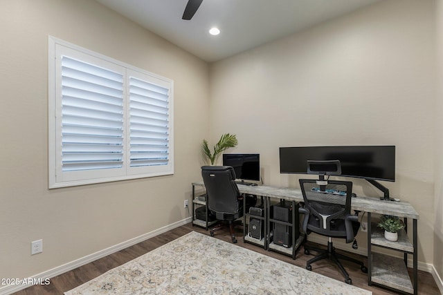 office area with wood finished floors, baseboards, and a ceiling fan