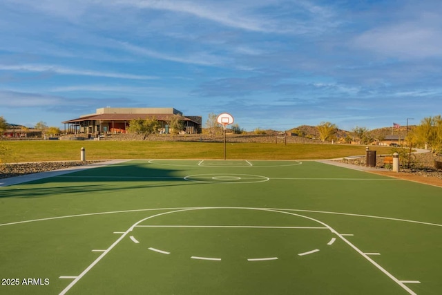 view of sport court featuring community basketball court and a lawn
