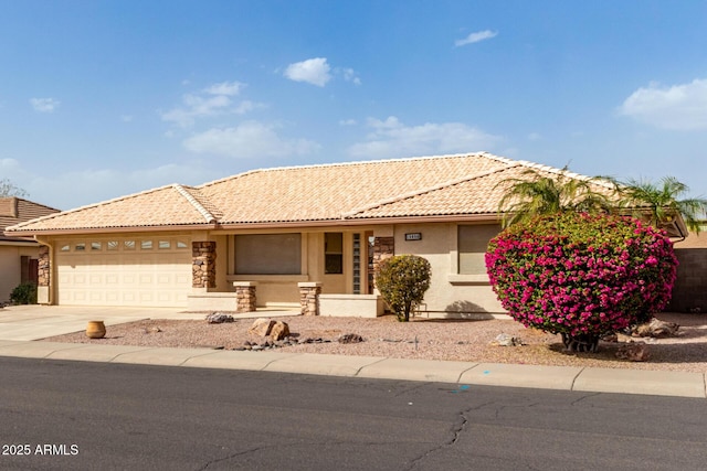 single story home featuring a garage, stucco siding, driveway, and a tiled roof