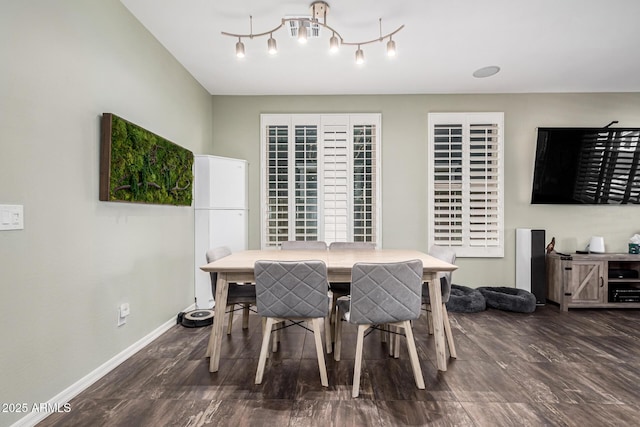 dining space featuring dark wood-type flooring