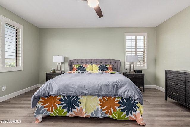 bedroom with hardwood / wood-style flooring and ceiling fan