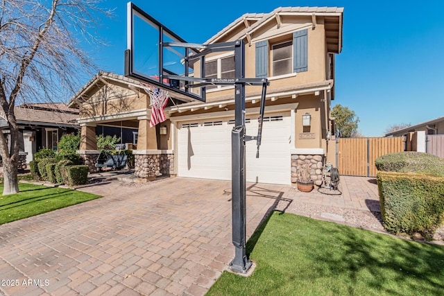 view of front of property with a garage and a front lawn