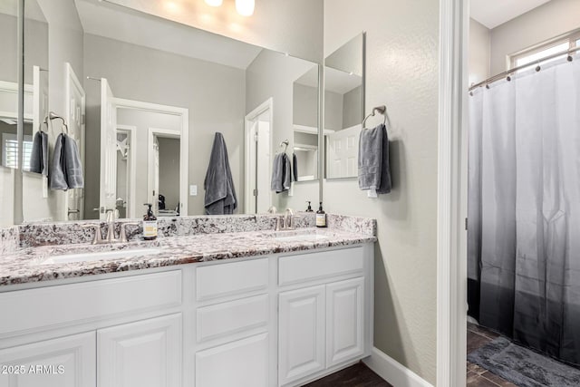 bathroom with vanity and a shower with curtain