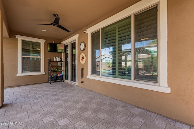 view of patio featuring ceiling fan