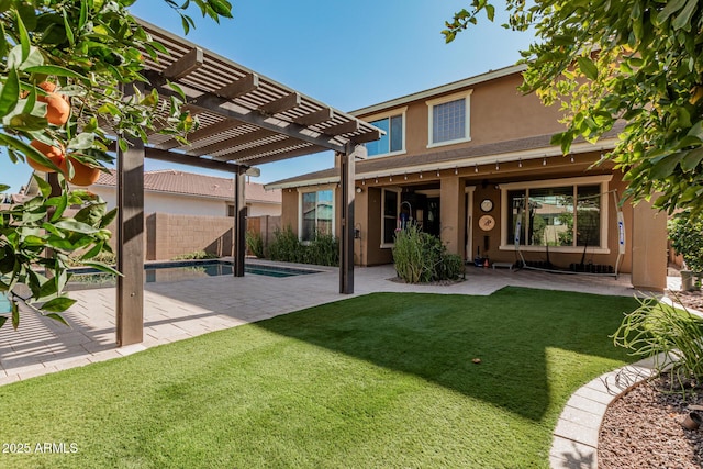 back of property featuring a pool, a patio, a pergola, and a lawn