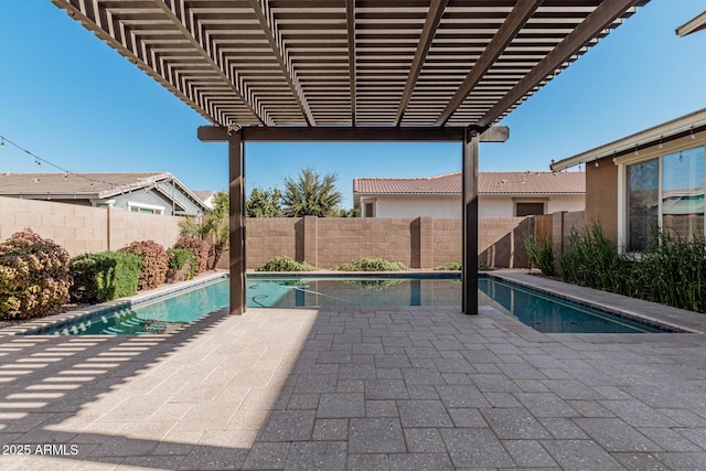 view of pool with a pergola and a patio