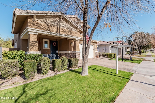 view of front of property featuring a garage and a front lawn