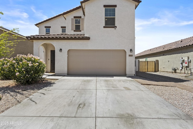 19239 W Elm St, Litchfield Park, AZ 85340 - mediterranean / spanish-style house with stucco siding, a tile roof, an attached garage, and driveway