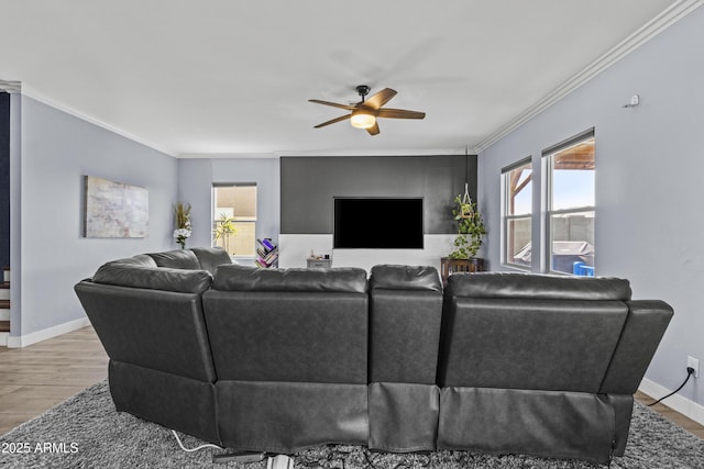 19239 W Elm St, Litchfield Park, AZ 85340 - living room with healthy amount of natural light, a ceiling fan, crown molding, and wood finished floors