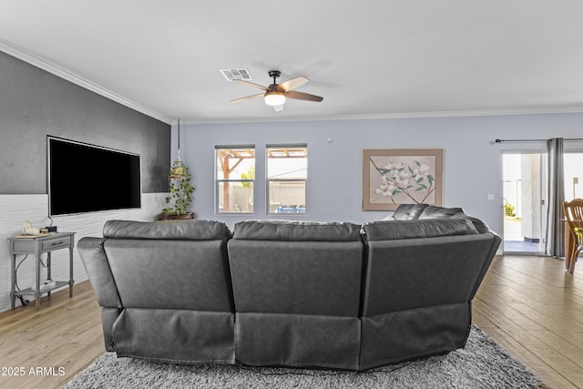 19239 W Elm St, Litchfield Park, AZ 85340 - living area with healthy amount of natural light, light wood-style flooring, ceiling fan, and crown molding