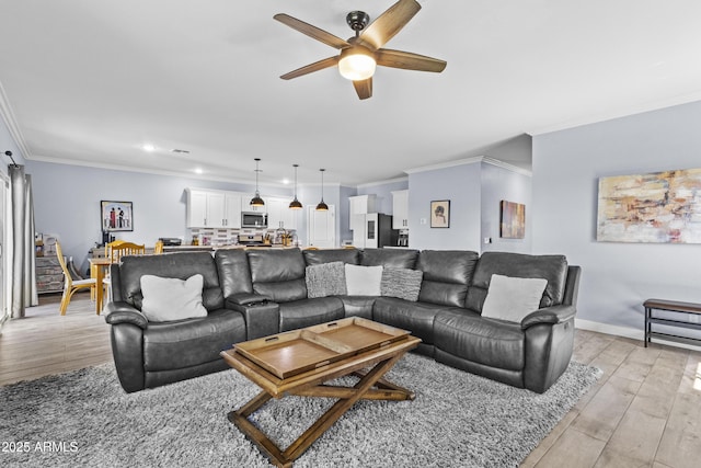 19239 W Elm St, Litchfield Park, AZ 85340 - living area with a ceiling fan, crown molding, light wood-style flooring, and recessed lighting