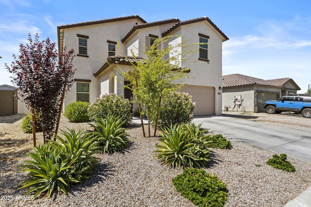 19239 W Elm St, Litchfield Park, AZ 85340 - mediterranean / spanish house featuring a tiled roof, driveway, a garage, and stucco siding