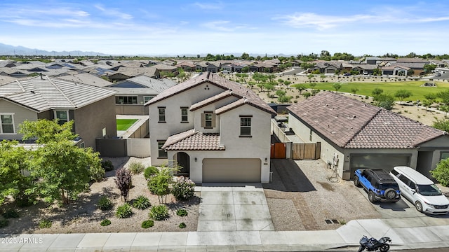 19239 W Elm St, Litchfield Park, AZ 85340 - view of front of property with a residential view, concrete driveway, and stucco siding
