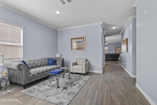 19239 W Elm St, Litchfield Park, AZ 85340 - living area featuring ornamental molding, plenty of natural light, wood finished floors, and recessed lighting