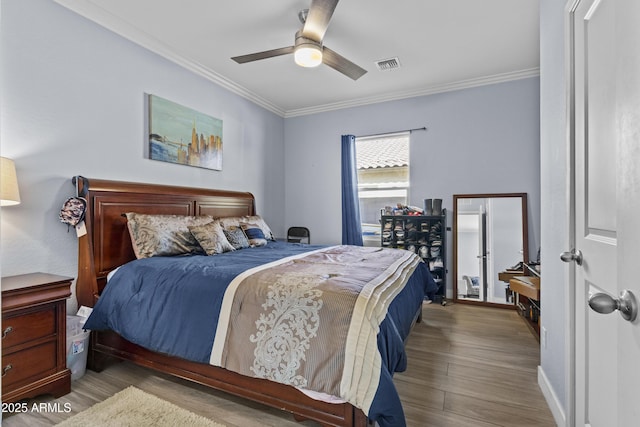 19239 W Elm St, Litchfield Park, AZ 85340 - bedroom featuring wood finished floors, ornamental molding, and a ceiling fan