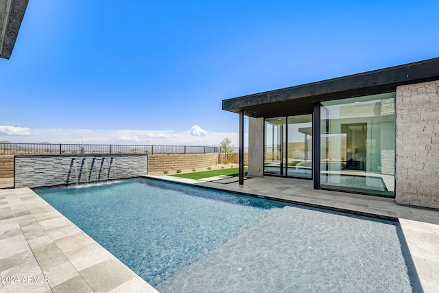 view of pool featuring a patio and pool water feature