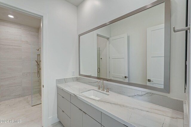 bathroom with vanity and walk in shower