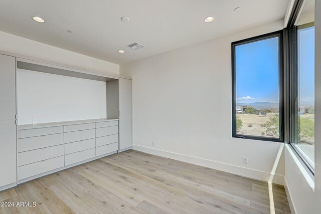 unfurnished bedroom featuring light wood-type flooring