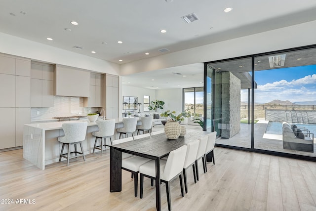 dining space with light wood-type flooring